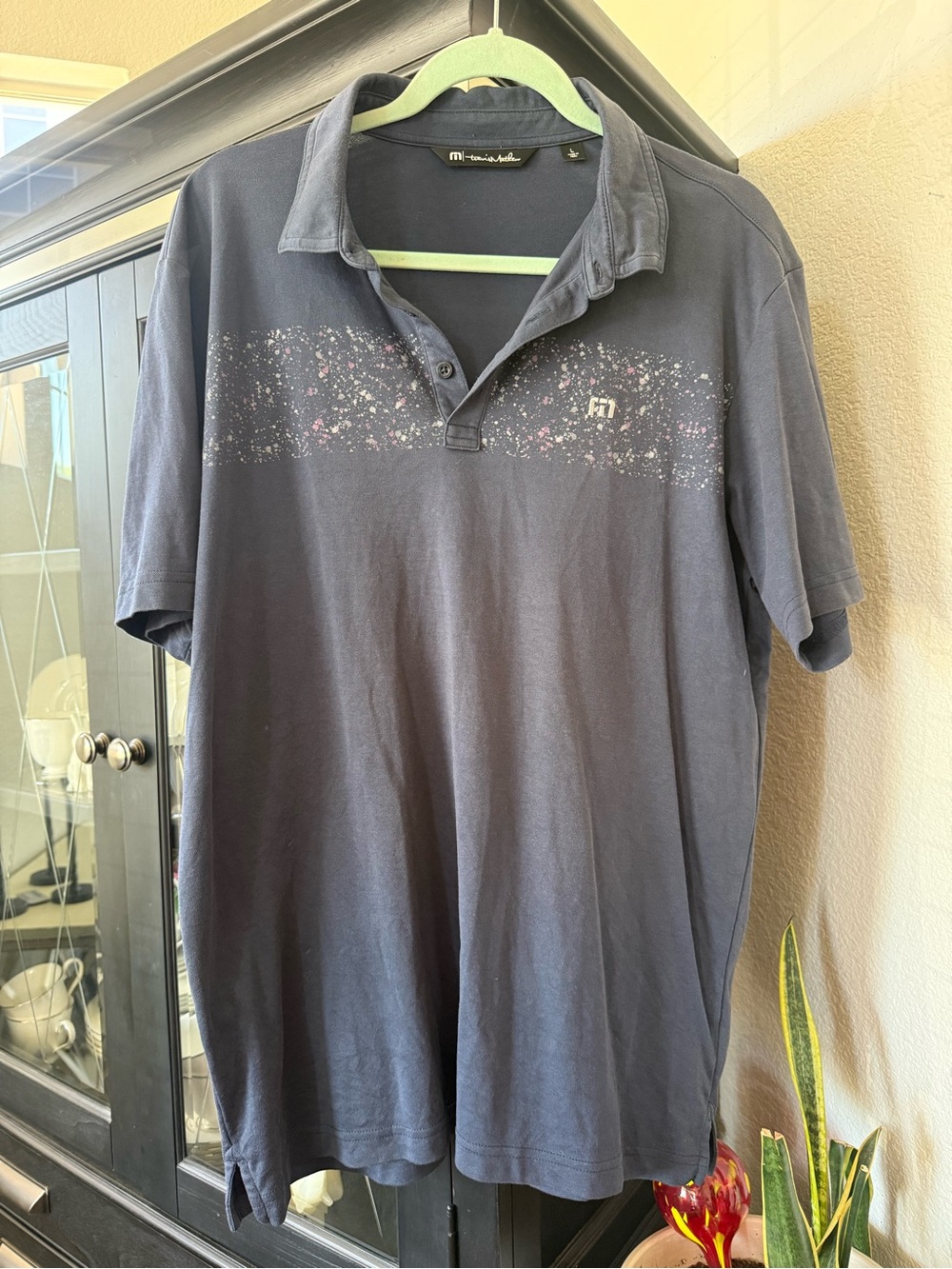 Travis Mathew Navy Polo with Subtle Multicolor Speckle